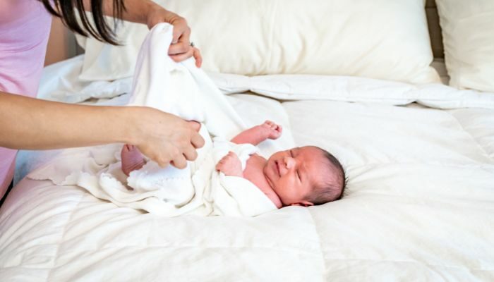 The first thing of choosing the perfect swaddle or sleep sack is to think about the baby's size
