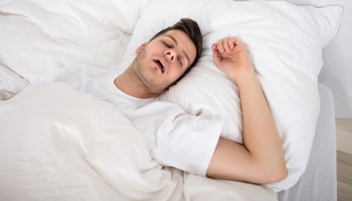 One of the easiest and most effective ways to instantly stop your partner's snoring is not to let them sleep on their back