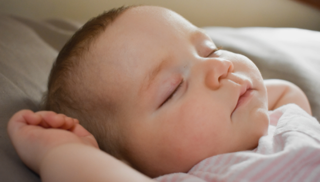 what makes baby smile during sleep?